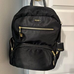 Tumi Black Backpack with Gold Hardware Accents